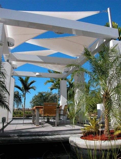 An Outdoor Dining Area With Tables Chairs And Umbrellas