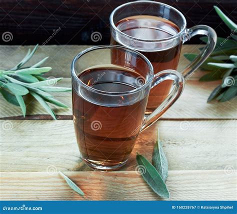 Sage Herbal Tea Or Decoction In A Glass Cups With Herb Leaves Stock