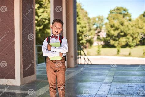 The Child Goes To Primary School Portrait Of A Happy Child With A