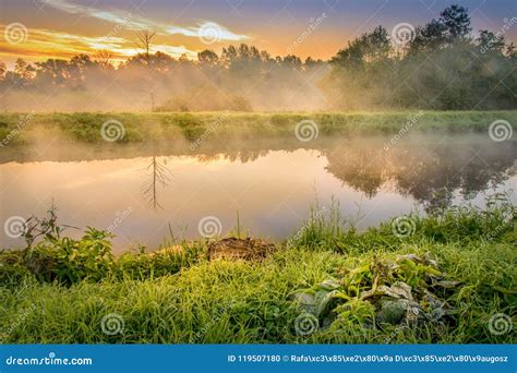 A Beautiful Sunrise Over A Misty Meadow And A River Stock Photo Image