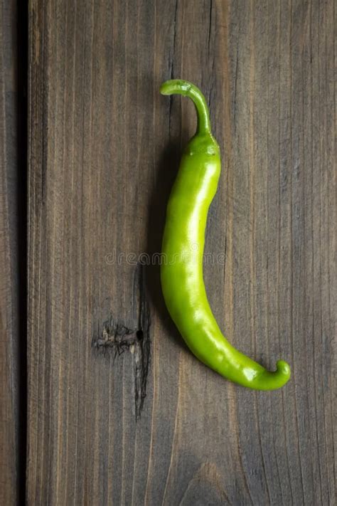 Green Chili Pepper Pod On A Wooden Table Green Pepper On The Table