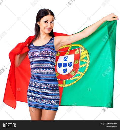 Young Beautiful Brunette Woman Holding A Large Flag Of Portugal