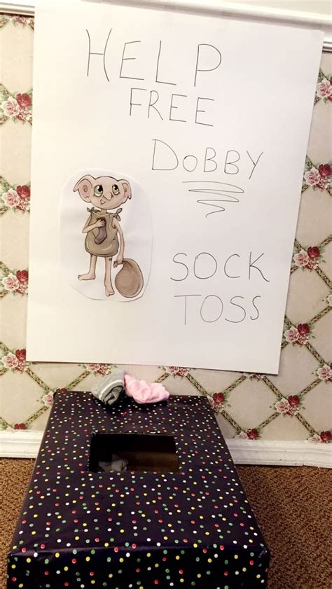 There Is A Sign That Says Help Free Dobby Sock Tosses On The Floor