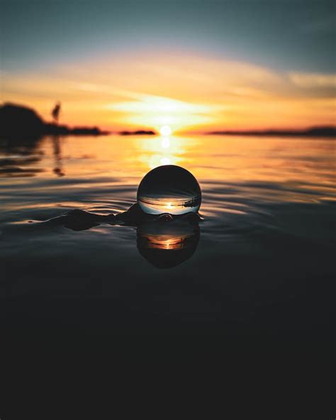 Crystal Ball in the Water at Sunset · Free Stock Photo