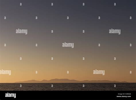 island of santorini at sunset. view from the sea Stock Photo - Alamy