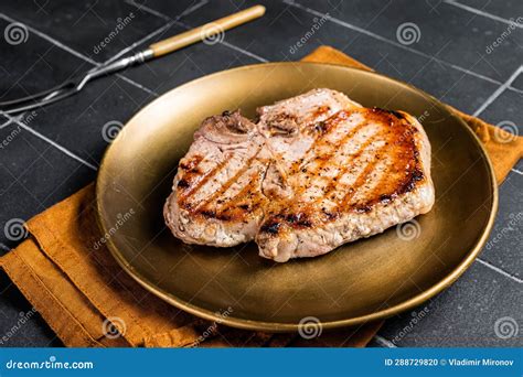 Bbq Fried Pork T Bone Chop Meat Steak On A Plate Black Background