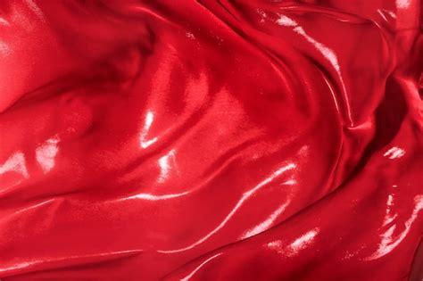 Premium Photo The Folds Of Red Silk Fabric Fluttering In The Wind