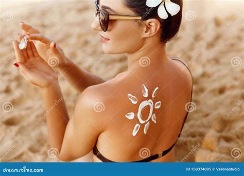 Woman Apply Sun Cream On Tanned Back Skin And Body Care Sun