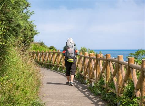 Premium Photo Lonely Pilgrim With Backpack Walking The Camino De