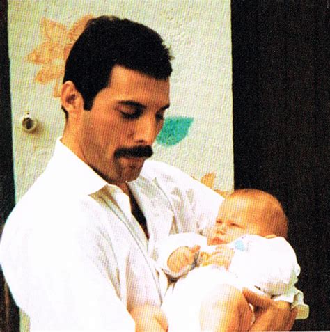 Freddie Mercury with a baby by Queenfan124 on DeviantArt