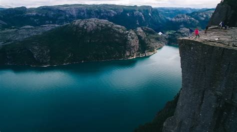 Premium Photo Couple In Love Preikestolen Massive Cliff Norway