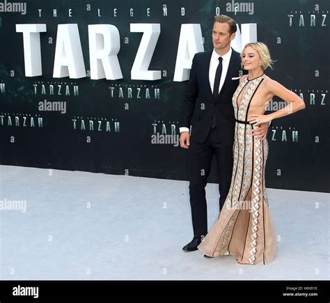 July Alexander Skarsgard And Margot Robbie Attending The