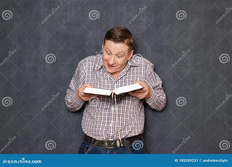 Portrait Of Happy Amazed Man Reading Big Book Stock Image Image Of