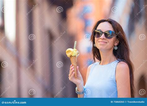 Attractive Woman On The Street Having Fun And Eating Ice Cream Young