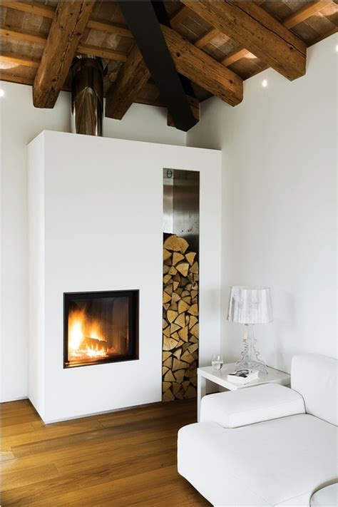 A Living Room Filled With Furniture And A Fire Place Next To A Wall