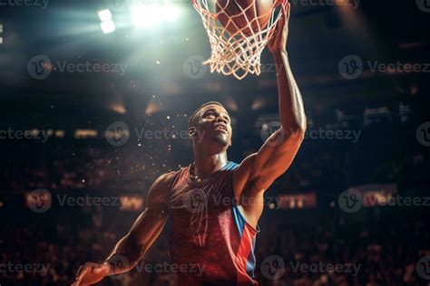 Male Basketball Player Playing Basketball In A Crowded Indoor