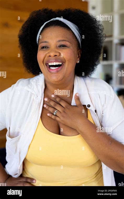 Happy Plus Size African American Woman Looking Away And Laughing Stock