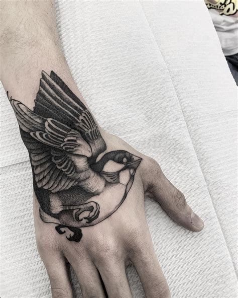 Amazing Bird Tattoo Design On Hand Hand Tattoos For Guys Incredible