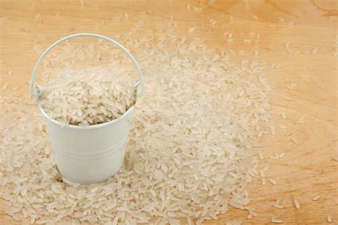 Bucket Of Rice Crumbles In The A Wooden Spoon Stock Image Image Of