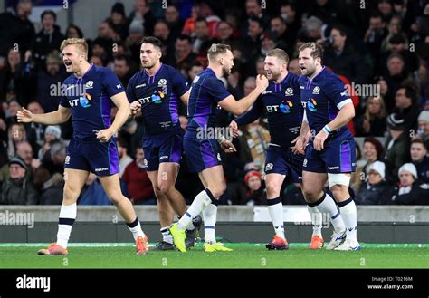 Scotland's Finn Russell celebrates scoring his side's fifth try of the ...