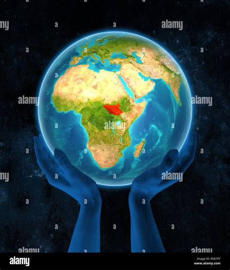 South Sudan In Red On Globe Held In Hands In Space D Illustration