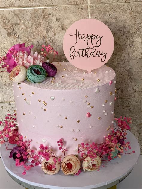 Close Up Of A Birthday Cake With Flowers · Free Stock Photo