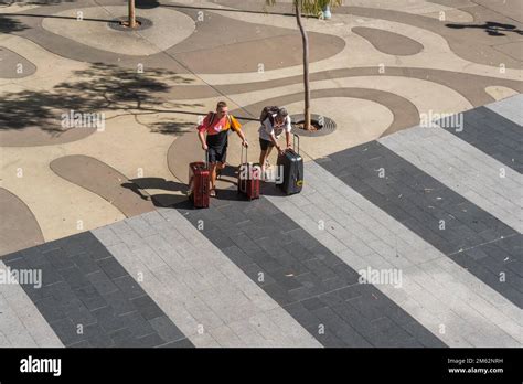 Overhead View Of Airport Passengers Pushing Luggage Adelaide