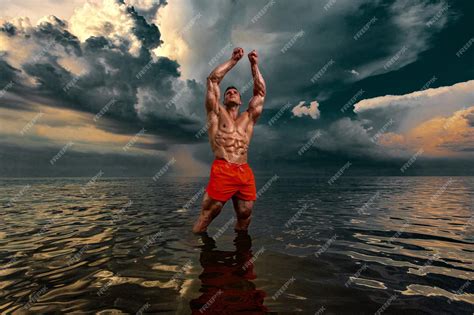 Premium Photo Fit Athlete Bodybuilder On The Beach Attractive Young