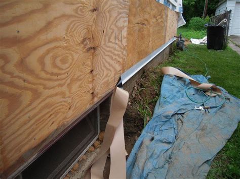 The Back Side Of A House Being Constructed With Plywood Boards And Wood