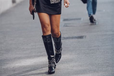 Female Wearing Black Leather Skirt And Black Boots White Silver