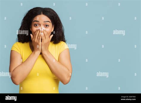 Shocked African American Lady Covering Her Mouth With Hands In Surprise