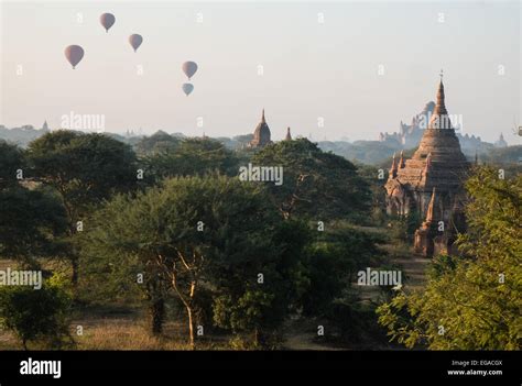 View Of Sunrise From Stairs Of Temple With Hot Air Balloons Floating Flight Over Temples On