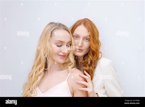 Beauty Picture Gorgeous Happy Optimistic Beautiful Blonde And Redhead Women Posing Isolated Over