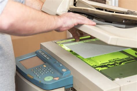 Copying And Scanning Documents On A Machine Stock Photo Image Of Hand