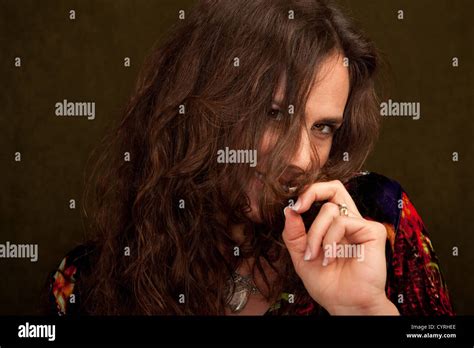 Pretty Brunette Woman With Hair In Her Face Stock Photo Alamy
