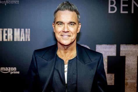 Robbie Williams Jokes He Wants To Be Gay Calls Wife A Beard In Bizarre Interview Years
