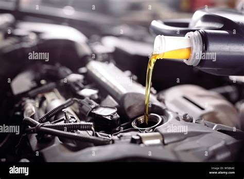 Motor Oil Pouring To Car Engine Repair Service Stock Photo Alamy