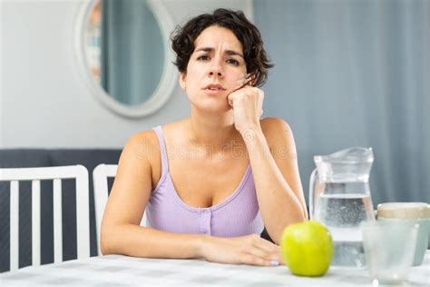 Portrait Of Thoughtful Girl Sitting At Table In Apartment Stock Image Image Of Lonely Despair