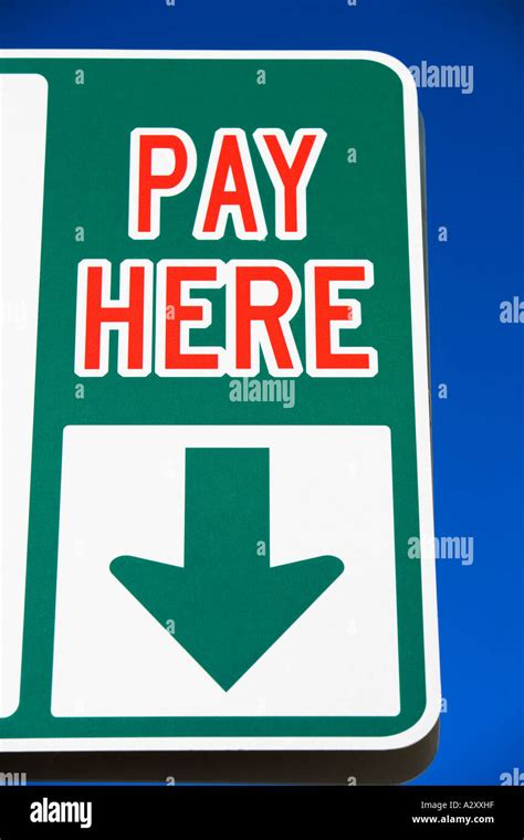 Pay Here Sign With Arrow Stock Photo Alamy