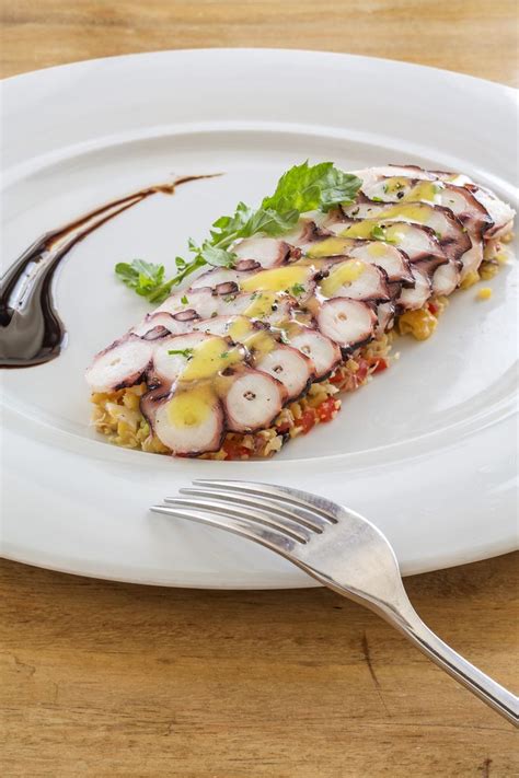 Our Delicious Homemade Octopus Carpaccio Served Atop Savory Chickpea