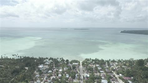 Aerial View Of Village Near Beautiful Beach With Small Island In The