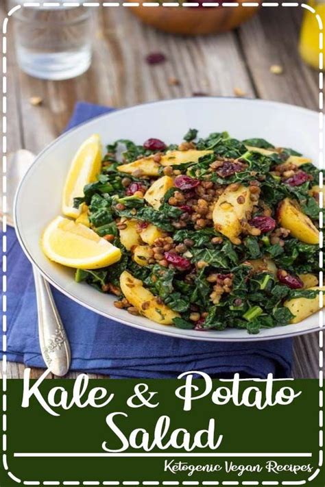 Kale And Potato Salad In A White Bowl With Lemon Wedges On The Side