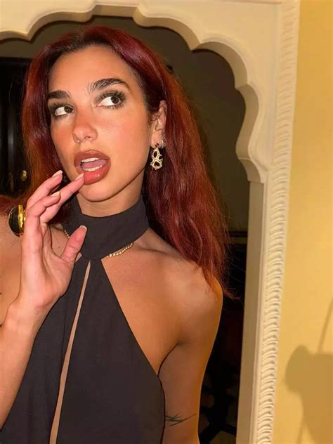 Dua Lipa Stuns In A Black Halter Neck Dress As She Celebrates Nye In