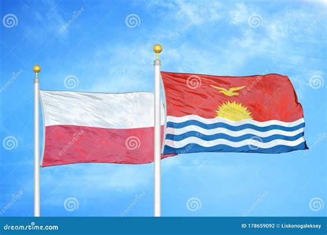 Poland and Kiribati Two Flags on Flagpoles and Blue Cloudy Sky Stock ...