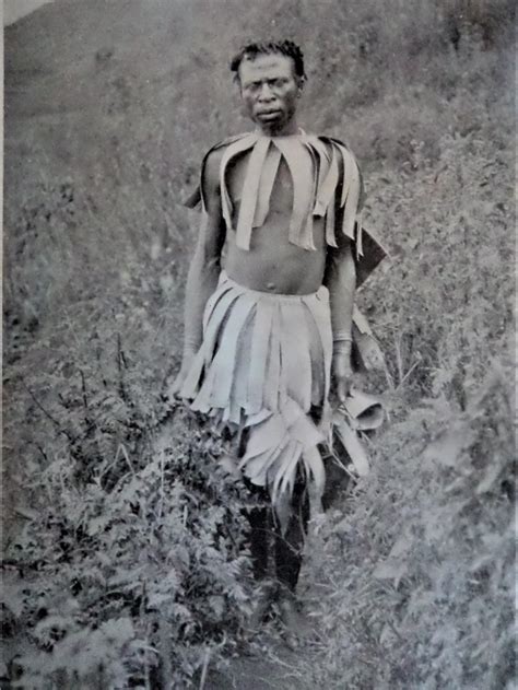 Native of Bafumbira, Uganda, with banana leaf clothing, 1911