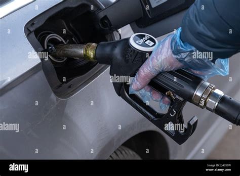 Diesel Refueling The Carrefueling Pistol In The Hand A Man Fills Up