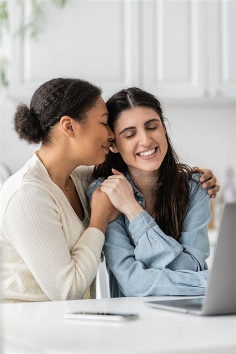 Interracial Lesbian Couple Spending Time Together Outdoors Stock Photo