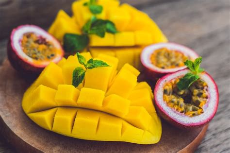 Premium Photo Mango And Passion Fruit On An Old Wooden Table