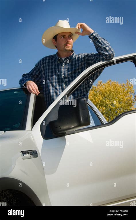 Cowboy with truck Stock Photo - Alamy