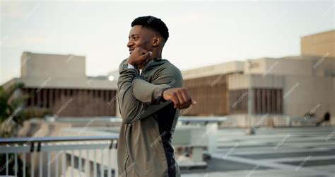 Premium Photo Black Man Fitness And Stretching On Rooftop In City For